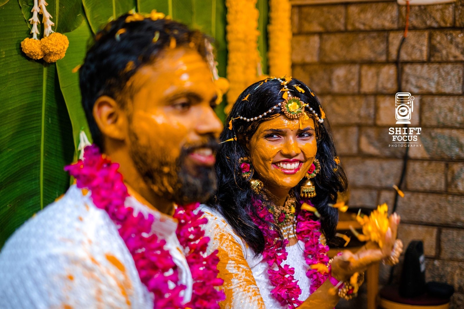 Couple laughing during the haldi ceremony